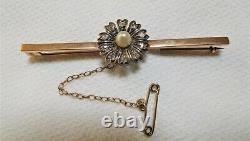 Antique 9 ct rose gold flower set brooch with 10 old/rose cut diamonds. C 1900