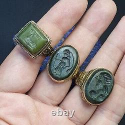 Lot antique de 3 anciennes bagues de sceau sculptées en jade de l'ancien Proche-Orient représentant des animaux et des humains.